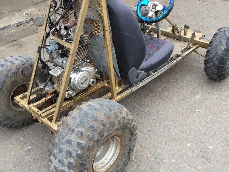 This is a custom built go kart. It has a 200cc motorbike engine . It is 5 speed manual.Not to miss