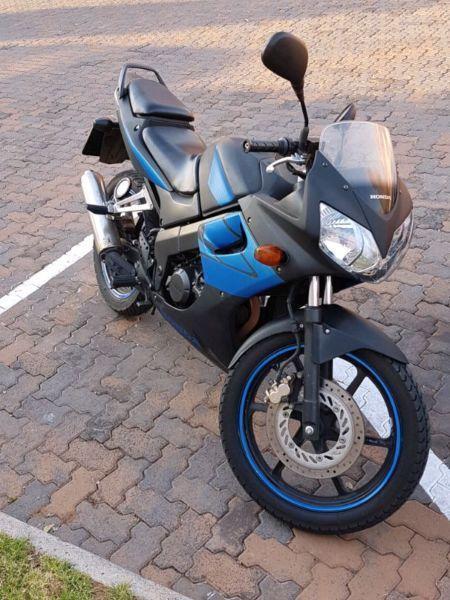 Black and blue 2008 CBR 125 R