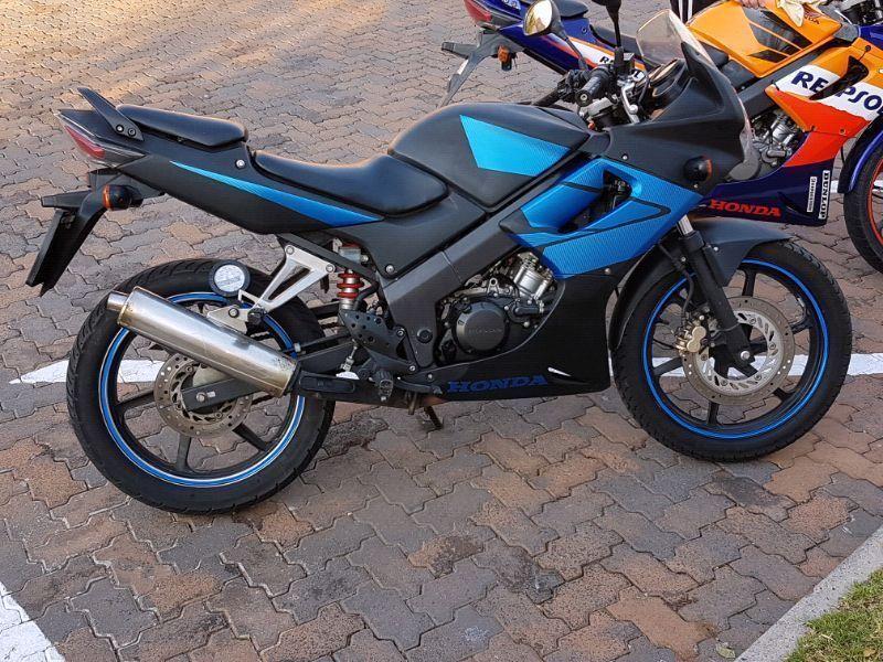 Black and blue 2008 CBR 125 R