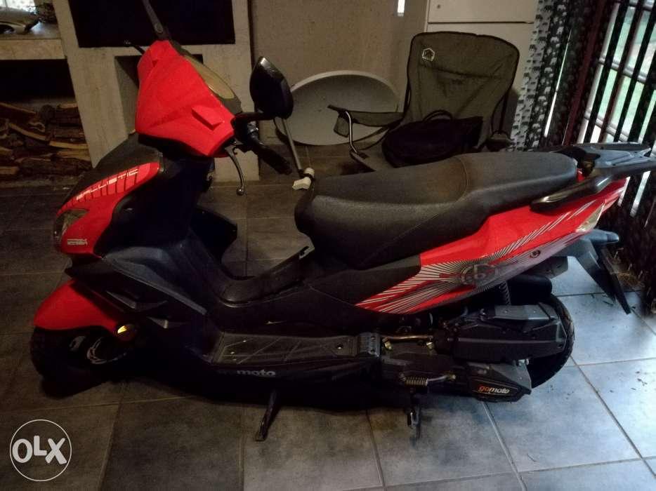 Red GOMOTO 150cc Scooter with two helmets for sale