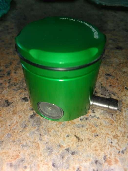 Brake/clutch fluid container motorcyle