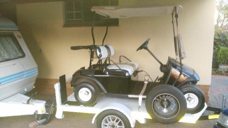 Ez go golf cart on easy loader trailer in excellent condition