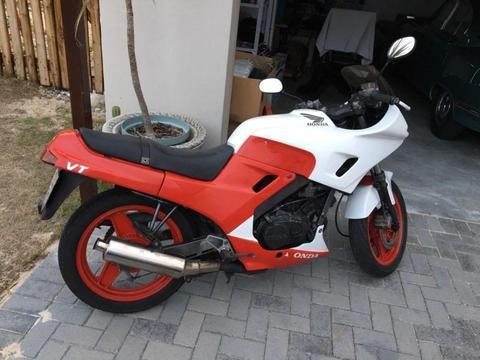 One of a kind customized Honda VTR 250 in a classy red and white finish!