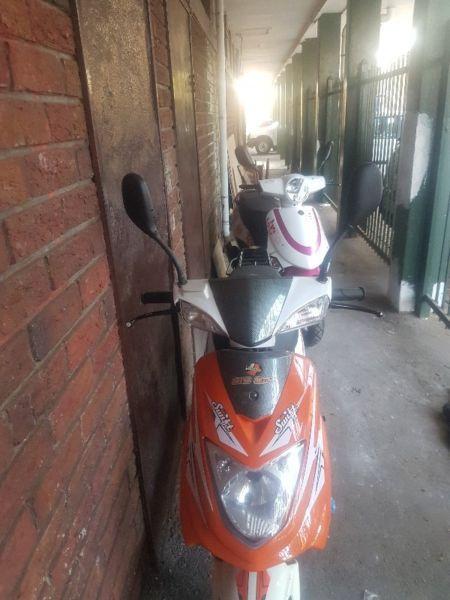Two very clean scooters for sale