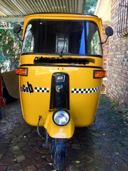 Tuktuk Bajaj. Yellow. 3 wheel tricycle