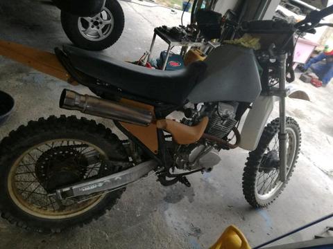 Off road bike with boots and upper body protection 